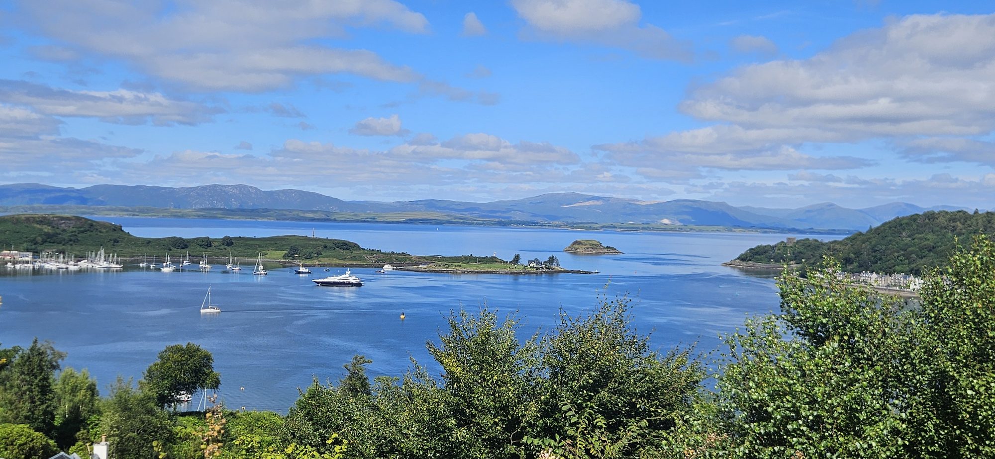 Oban harbour with yachts and hills beyond